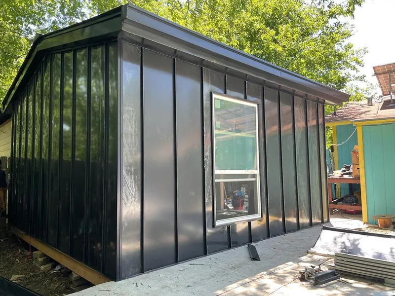 Black standing seam metal wall panels for Metal Roof Installation in Ruidoso