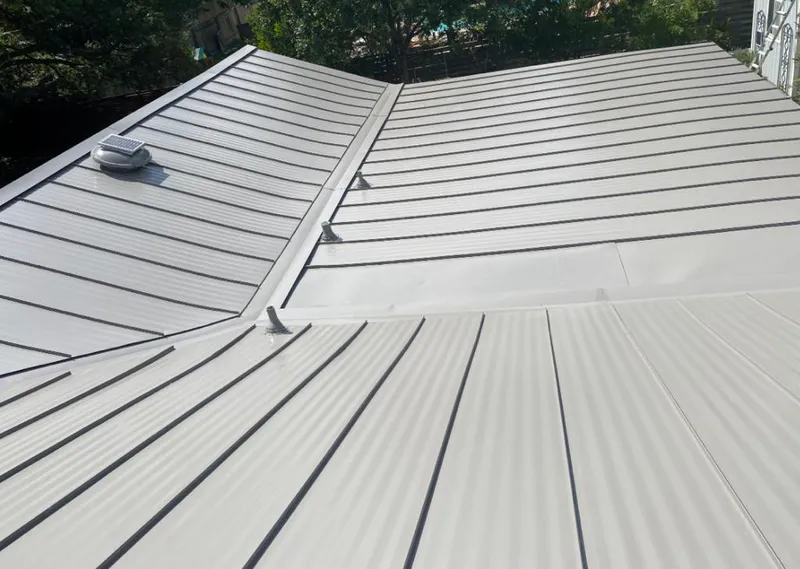 Solar attic fan installed on a metal roof for Roof Ventilation in Ruidoso